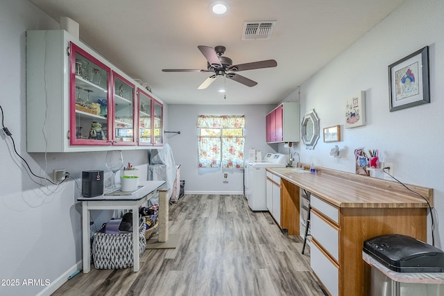 washroom with ceiling fan, hardwood / wood-style floors, and washing machine and dryer