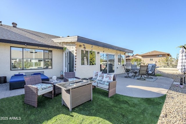 view of patio / terrace featuring an outdoor living space with a fire pit