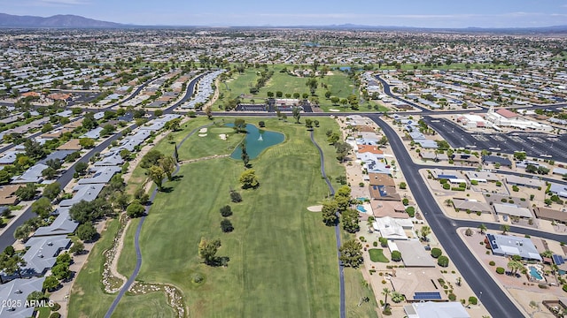 drone / aerial view featuring a water and mountain view