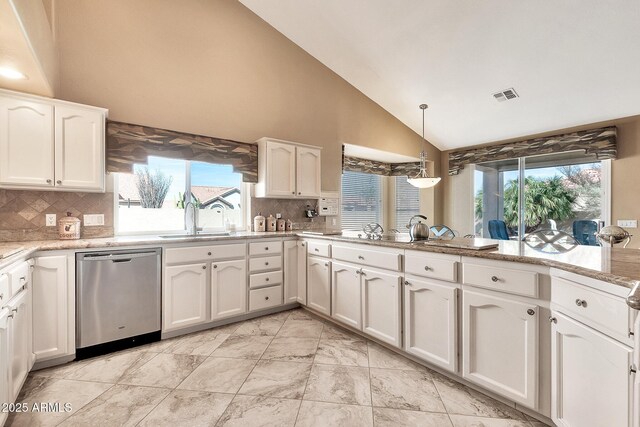 kitchen with hanging light fixtures, white cabinetry, and stainless steel dishwasher