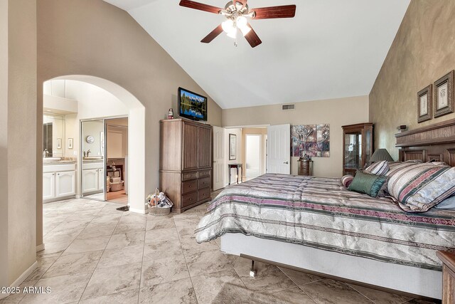 bedroom featuring high vaulted ceiling, visible vents, arched walkways, and a sink