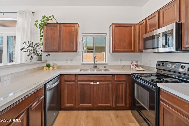 2150 E Bell Rd Unit 1088, Phoenix, AZ 85022 - kitchen with appliances with stainless steel finishes, light wood-type flooring, healthy amount of natural light, and brown cabinetry