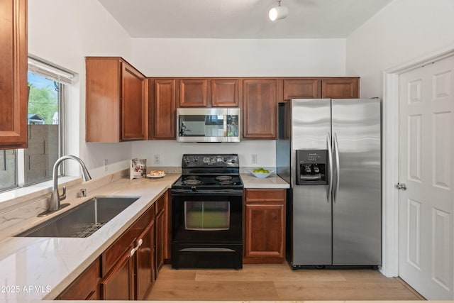 2150 E Bell Rd Unit 1088, Phoenix, AZ 85022 - kitchen featuring stainless steel appliances, light wood finished floors, and light stone countertops