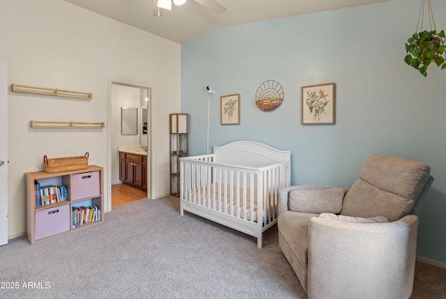 2150 E Bell Rd Unit 1088, Phoenix, AZ 85022 - bedroom with carpet flooring, lofted ceiling, a nursery area, connected bathroom, and a ceiling fan