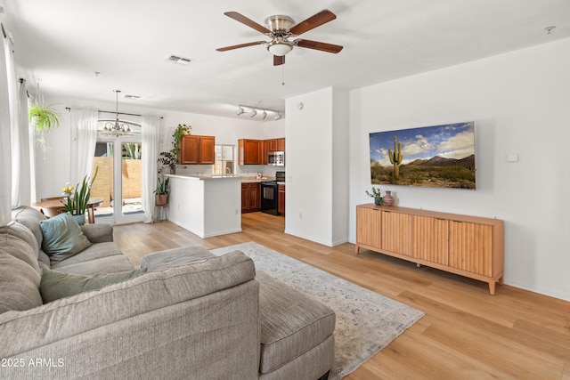 2150 E Bell Rd Unit 1088, Phoenix, AZ 85022 - living area with light wood-style flooring, ceiling fan, and track lighting
