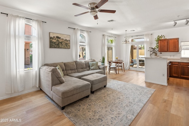 2150 E Bell Rd Unit 1088, Phoenix, AZ 85022 - living room with ceiling fan and light wood finished floors