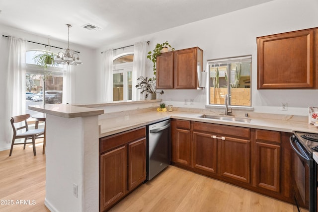 2150 E Bell Rd Unit 1088, Phoenix, AZ 85022 - kitchen featuring dishwasher, light wood-type flooring, a chandelier, black range oven, and a peninsula