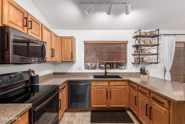 kitchen featuring black range with electric stovetop, light tile patterned flooring, a sink, dishwasher, and a peninsula