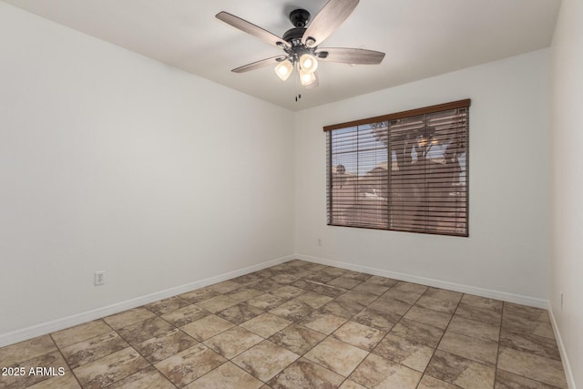 unfurnished room with baseboards and a ceiling fan