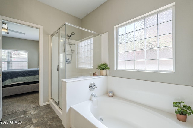 15848 W Calavar Rd, Surprise, AZ 85379 - ensuite bathroom with a shower stall, healthy amount of natural light, a bath, and stone finish flooring