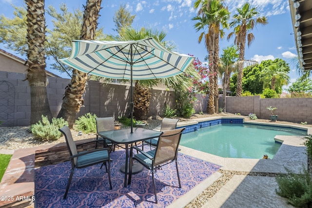 15848 W Calavar Rd, Surprise, AZ 85379 - view of pool with a fenced backyard, a patio, and outdoor dining space