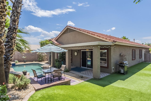 15848 W Calavar Rd, Surprise, AZ 85379 - rear view of house featuring stucco siding and a patio