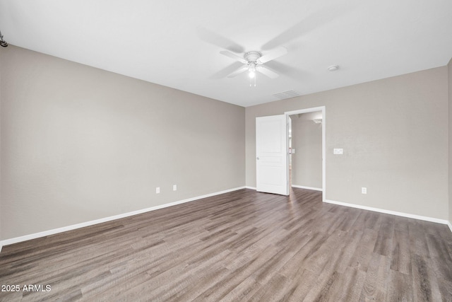 spare room with ceiling fan and light wood-type flooring