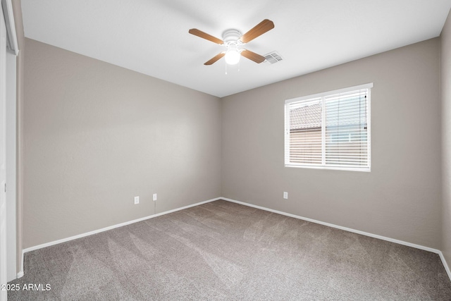 carpeted empty room with ceiling fan