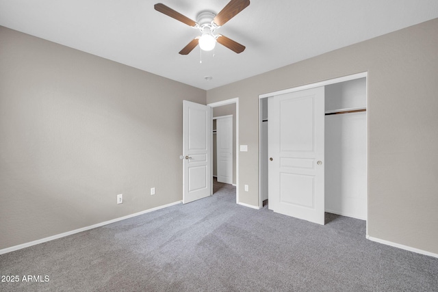 unfurnished bedroom with a closet, ceiling fan, and carpet flooring