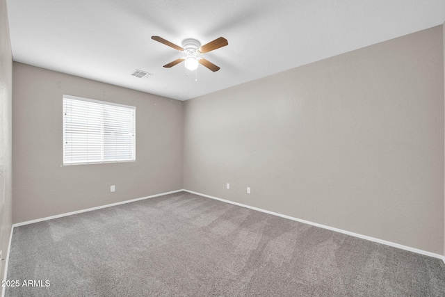 carpeted empty room with ceiling fan