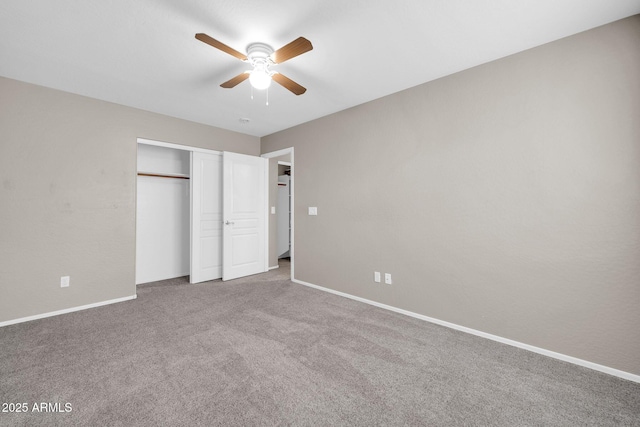 unfurnished bedroom featuring carpet flooring, ceiling fan, and a closet