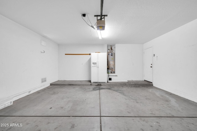 garage featuring a garage door opener and gas water heater