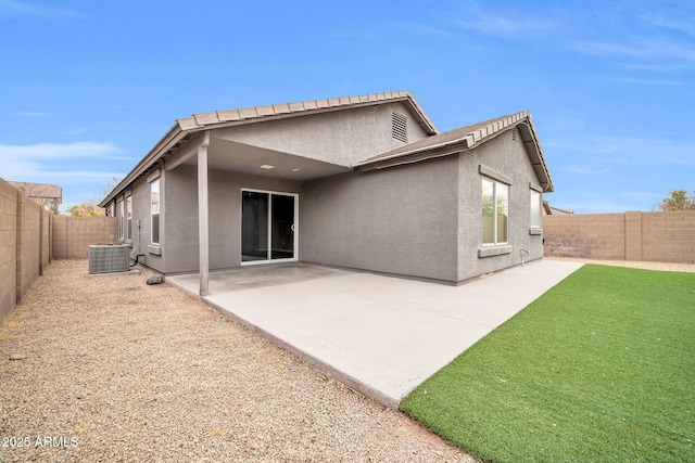 back of house with a patio and cooling unit