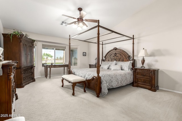 bedroom featuring visible vents, light carpet, baseboards, ceiling fan, and vaulted ceiling