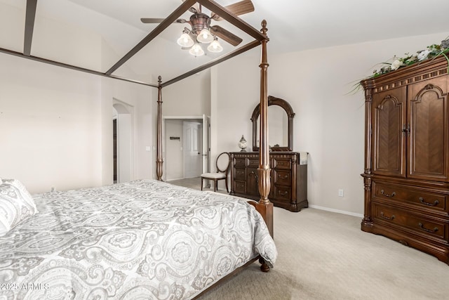 bedroom with light colored carpet, baseboards, a ceiling fan, and vaulted ceiling