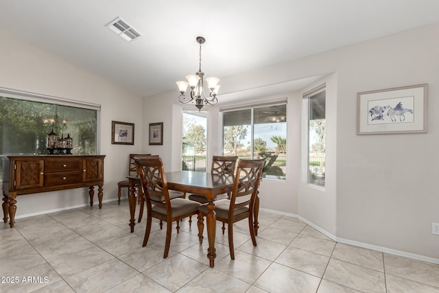 dining space featuring a chandelier, visible vents, light tile patterned floors, and vaulted ceiling