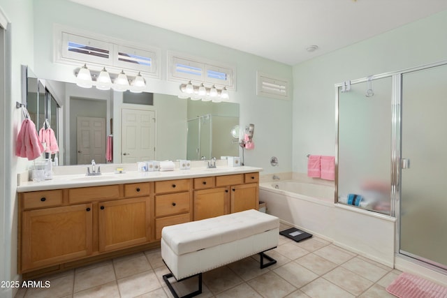 16158 W Copper Point Ln, Surprise, AZ 85374 - bathroom with a bath, a shower stall, tile patterned flooring, and double vanity