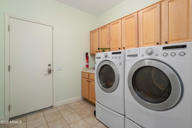 16158 W Copper Point Ln, Surprise, AZ 85374 - clothes washing area with washer and dryer, cabinet space, light tile patterned flooring, and baseboards