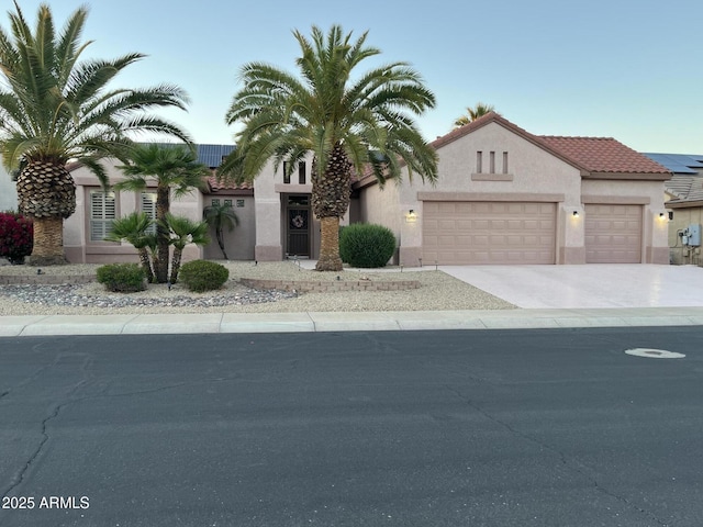 16158 W Copper Point Ln, Surprise, AZ 85374 - mediterranean / spanish home with a garage, stucco siding, driveway, and a tiled roof