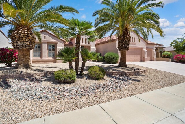 16158 W Copper Point Ln, Surprise, AZ 85374 - mediterranean / spanish-style house with concrete driveway, stucco siding, and a tile roof