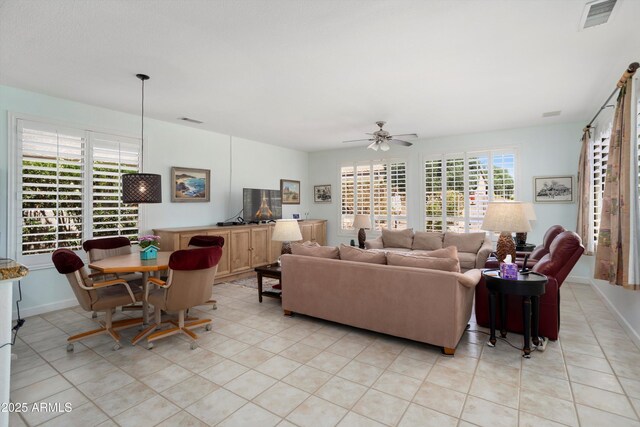 16158 W Copper Point Ln, Surprise, AZ 85374 - living room with ceiling fan, light tile patterned floors, and baseboards