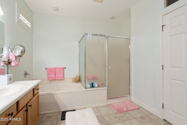 16158 W Copper Point Ln, Surprise, AZ 85374 - full bathroom featuring vanity, a stall shower, a bath, and tile patterned floors