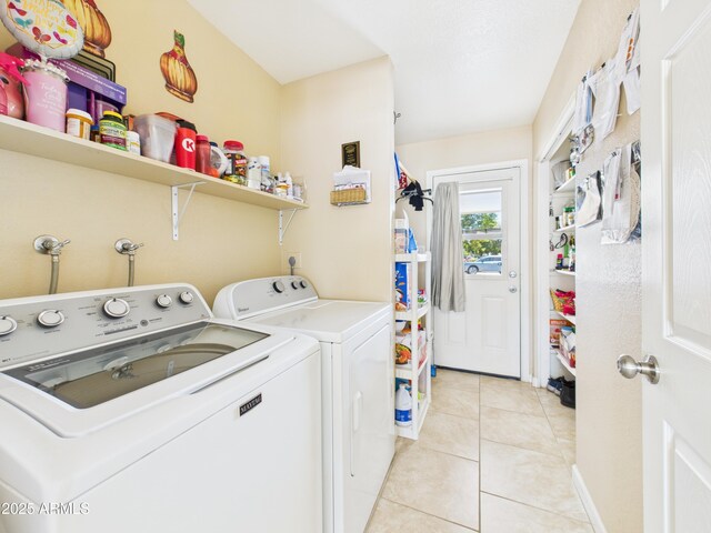 7676 W Sells Dr, Phoenix, AZ 85033 - washroom with laundry area, washing machine and clothes dryer, and light tile patterned floors