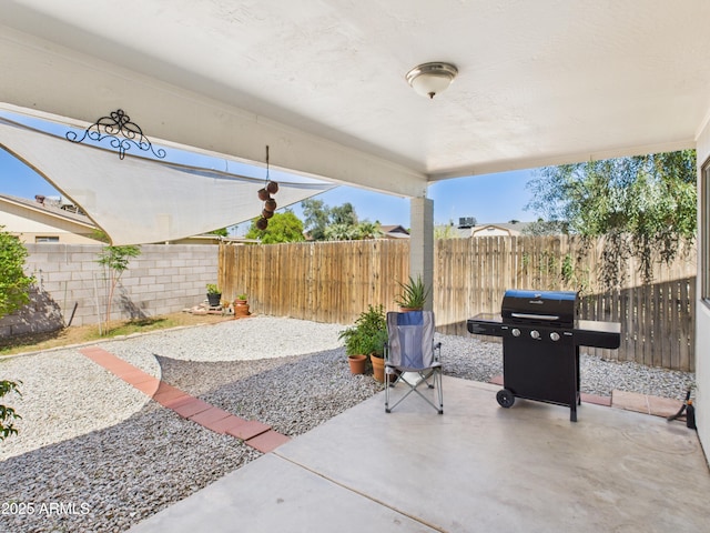 7676 W Sells Dr, Phoenix, AZ 85033 - view of patio with a fenced backyard and a grill