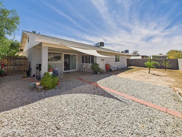 7676 W Sells Dr, Phoenix, AZ 85033 - rear view of house with a patio area, central air condition unit, and a fenced backyard
