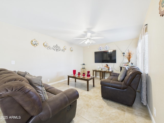 7676 W Sells Dr, Phoenix, AZ 85033 - living area featuring light tile patterned floors, baseboards, and a ceiling fan