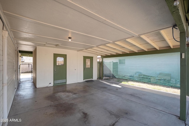 view of patio with a gate