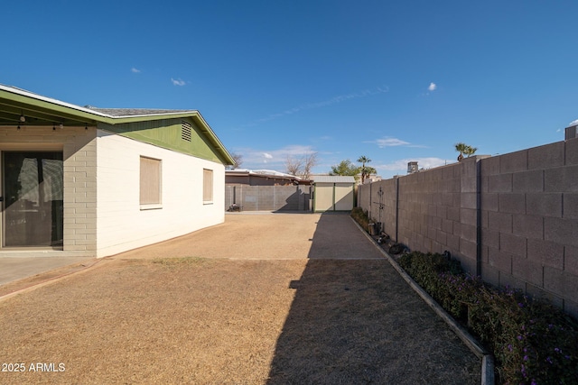 view of yard featuring a fenced backyard and a patio area