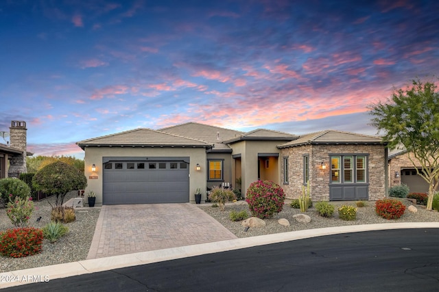 prairie-style house featuring a garage