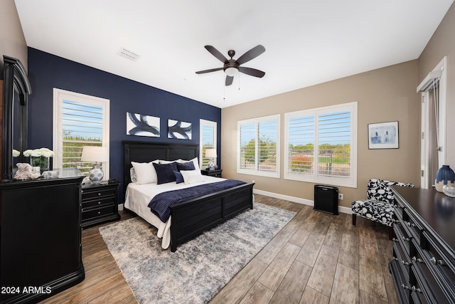 bedroom featuring ceiling fan and hardwood / wood-style flooring