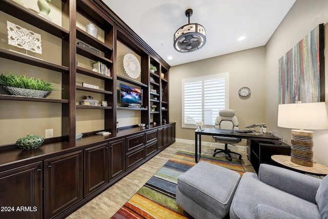 office area with light hardwood / wood-style flooring