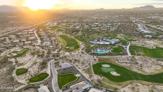 aerial view at dusk featuring a mountain view