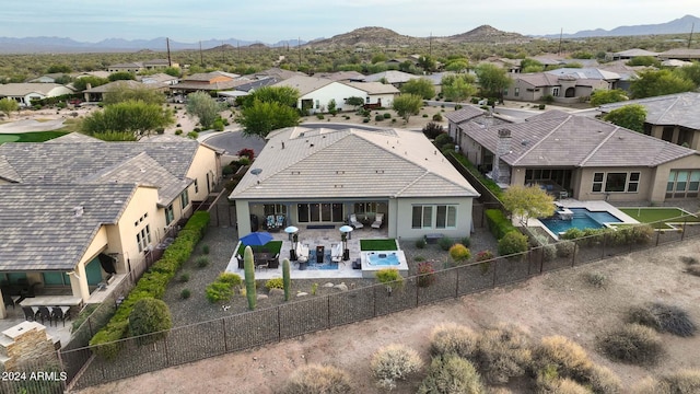 birds eye view of property with a mountain view