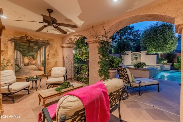 view of patio featuring ceiling fan