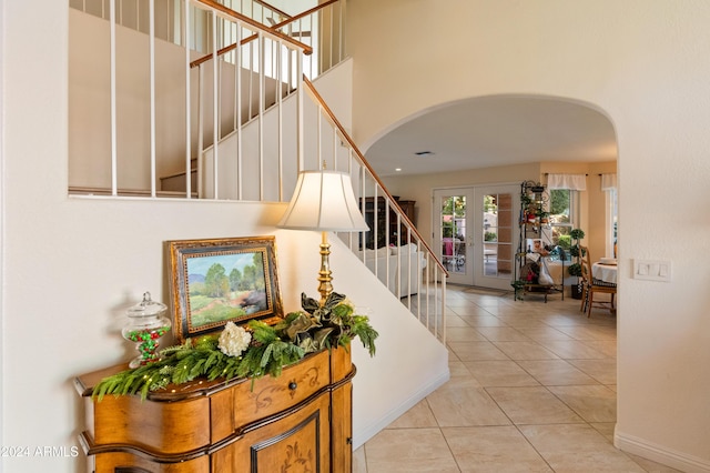 interior space featuring tile patterned floors and french doors