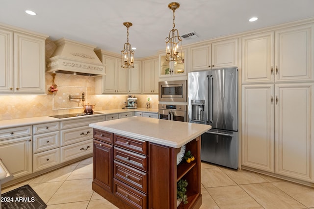 kitchen with custom exhaust hood, a center island, backsplash, light tile patterned flooring, and stainless steel appliances