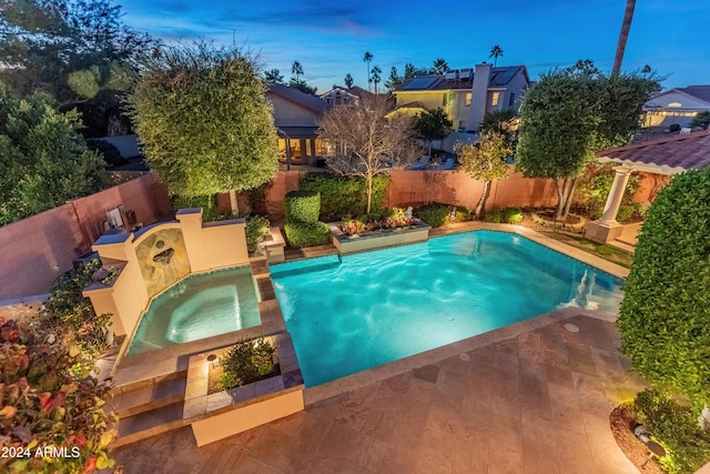 view of pool featuring an in ground hot tub