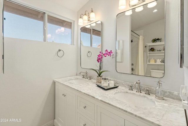 bathroom with a shower with shower curtain and vanity