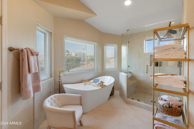 bathroom with independent shower and bath and vaulted ceiling