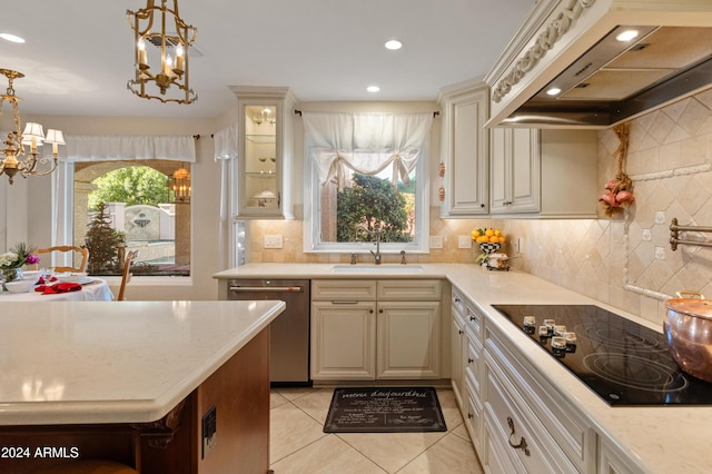 kitchen with black electric stovetop, sink, hanging light fixtures, stainless steel dishwasher, and custom range hood